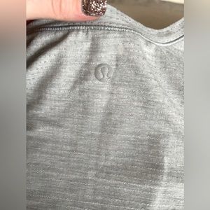 Size XL (14) fits like a 12/14 LuLulemon running vented tank top gray. EEUC